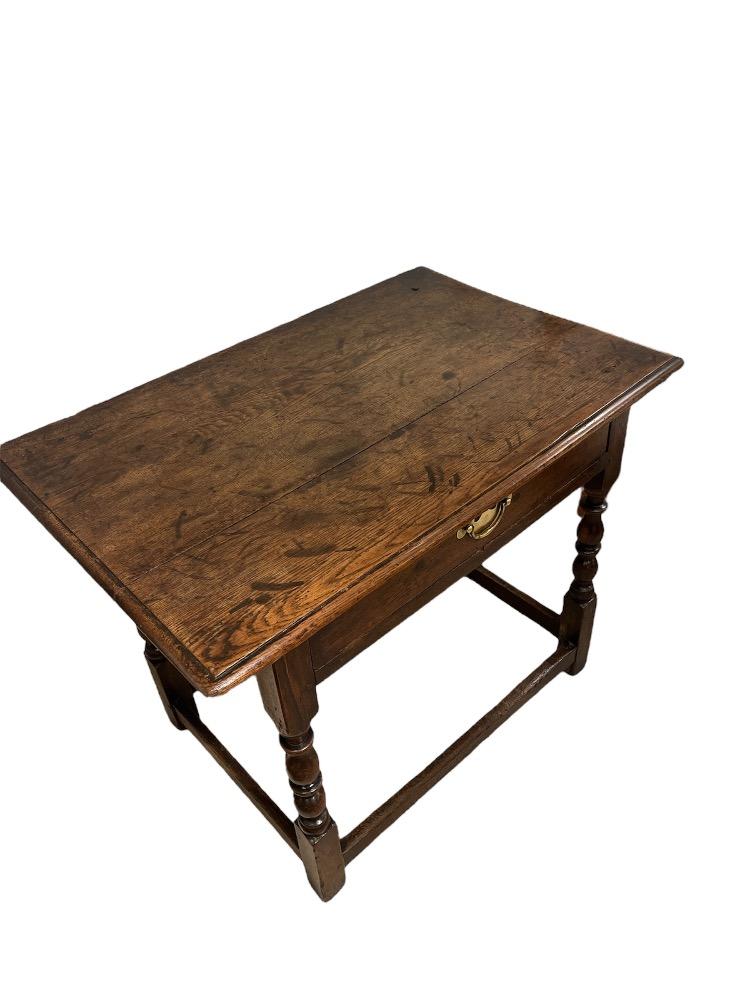 Oak accent table. France early 18th century.