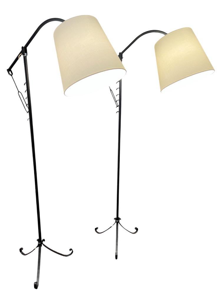 Pair of iron adjustable floor lamps. France circa 1950.