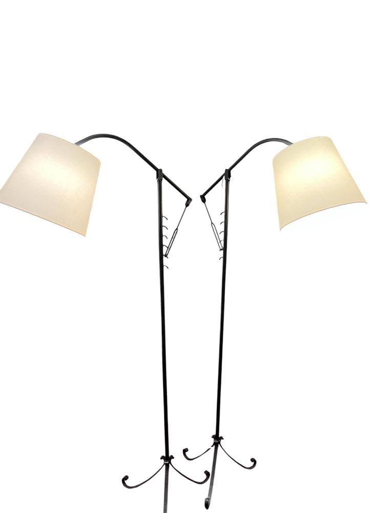 Pair of iron adjustable floor lamps. France circa 1950.